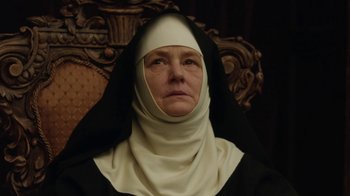 Movie still from “Novitiate” (2017), directed by Maggie Betts – An older woman wearing a nun's outfit; Close Up shot, Low angle