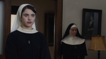 Movie still from “Novitiate” (2017), directed by Maggie Betts – Two women dressed in nun's clothes standing in front of a mirror; Close Up shot, Over the shoulder angle
