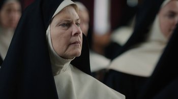 Movie still from “Novitiate” (2017), directed by Maggie Betts – An older woman wearing a nun's outfit; Close Up shot, Low angle