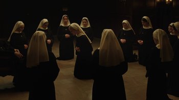 Movie still from “Novitiate” (2017), directed by Maggie Betts – A group of women dressed as nuns in a room; Wide shot, High angle