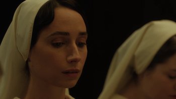 Movie still from “Novitiate” (2017), directed by Maggie Betts – A person wearing a veil; Close Up shot, Over the shoulder angle