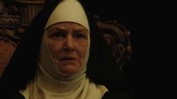 Movie still from “Novitiate” (2017), directed by Maggie Betts – An older woman wearing a nun's outfit; Close Up shot, Low angle