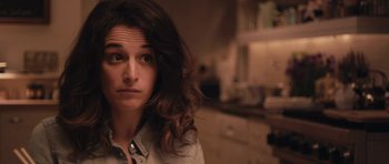 Movie still from “Obvious Child” (2014), directed by Gillian Robespierre – A person with long hair; Close Up shot, Over the shoulder angle