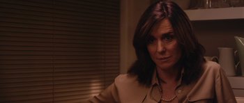 Movie still from “Obvious Child” (2014), directed by Gillian Robespierre – A person wearing a brown shirt; Close Up shot, Over the shoulder angle