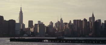 Movie still from “Obvious Child” (2014), directed by Gillian Robespierre – A boat is in front of a city skyline; Extreme Wide shot, Low angle