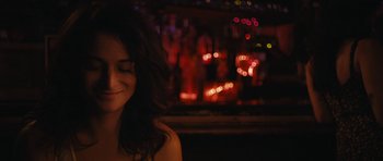 Movie still from “Obvious Child” (2014), directed by Gillian Robespierre – A woman sitting in front of a bar at night; Close Up shot, Over the shoulder angle