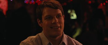 Movie still from “Obvious Child” (2014), directed by Gillian Robespierre – A person smiling at the camera; Close Up shot, Over the shoulder angle