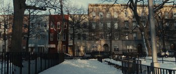 Movie still from “Obvious Child” (2014), directed by Gillian Robespierre – A building that is in the middle of a snow covered yard; Extreme Wide shot, Low angle
