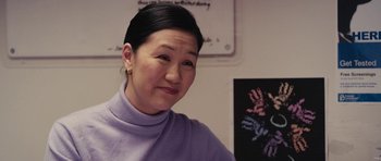 Movie still from “Obvious Child” (2014), directed by Gillian Robespierre – A woman in a purple sweater is looking at the camera; Close Up shot, Over the shoulder angle