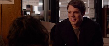 Movie still from “Obvious Child” (2014), directed by Gillian Robespierre – A man sitting in front of a woman in a restaurant; Close Up shot, Over the shoulder angle