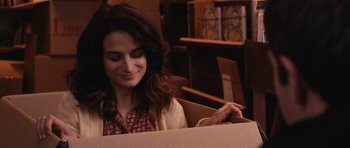 Movie still from “Obvious Child” (2014), directed by Gillian Robespierre – A woman sitting in front of a cardboard box; Close Up shot, Over the shoulder angle