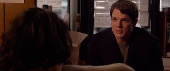 Movie still from “Obvious Child” (2014), directed by Gillian Robespierre – A man sitting at a table in front of a woman; Close Up shot, Over the shoulder angle