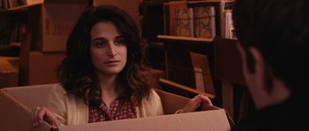 Movie still from “Obvious Child” (2014), directed by Gillian Robespierre – A woman sitting inside of a box in a room; Close Up shot, Over the shoulder angle
