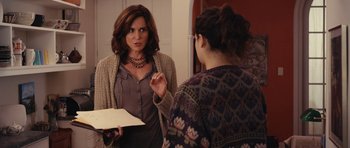 Movie still from “Obvious Child” (2014), directed by Gillian Robespierre – A woman standing in front of a mirror talking to another woman; Medium shot, Over the shoulder angle