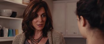 Movie still from “Obvious Child” (2014), directed by Gillian Robespierre – A person wearing a necklace; Close Up shot, Over the shoulder angle