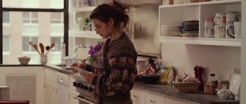 Movie still from “Obvious Child” (2014), directed by Gillian Robespierre – A woman in a kitchen looking at a tablet computer; Medium shot, Over the shoulder angle