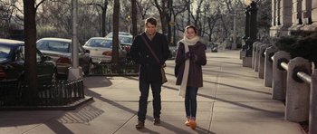 Movie still from “Obvious Child” (2014), directed by Gillian Robespierre – A man and a woman walking down a sidewalk; Wide shot, Over the shoulder angle