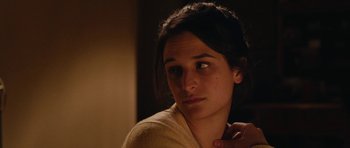 Movie still from “Obvious Child” (2014), directed by Gillian Robespierre – A young woman is looking at the camera; Close Up shot, Over the shoulder angle