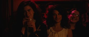 Movie still from “Obvious Child” (2014), directed by Gillian Robespierre – Two women are posing for a picture in the dark; Close Up shot, Over the shoulder angle