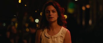 Movie still from “Obvious Child” (2014), directed by Gillian Robespierre – A woman with long red hair standing in the dark; Close Up shot, Over the shoulder angle