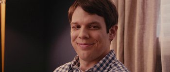 Movie still from “Obvious Child” (2014), directed by Gillian Robespierre – A person smiling; Close Up shot, Over the shoulder angle