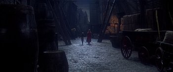 Movie still from “Oliver!” (1968), directed by Carol Reed – Two children are walking through a dark alley; Wide shot, High angle