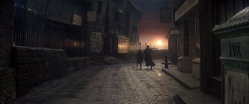 Movie still from “Oliver!” (1968), directed by Carol Reed – Two people walking down a street at night; Extreme Wide shot, High angle
