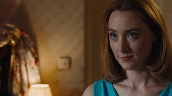 Movie still from “On Chesil Beach” (2017), directed by Dominic Cooke – A person wearing a blue shirt; Close Up shot, Over the shoulder angle