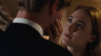 Movie still from “On Chesil Beach” (2017), directed by Dominic Cooke – A man and a woman looking at one another; Close Up shot, Over the shoulder angle