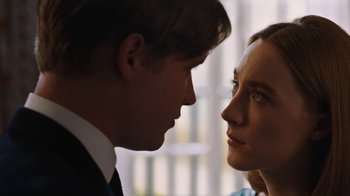 Movie still from “On Chesil Beach” (2017), directed by Dominic Cooke – A man and a woman face to face in front of a window; Close Up shot, Over the shoulder angle