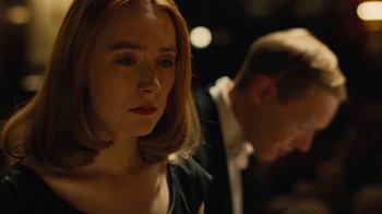 Movie still from “On Chesil Beach” (2017), directed by Dominic Cooke – A person in a dark room; Close Up shot, Over the shoulder angle