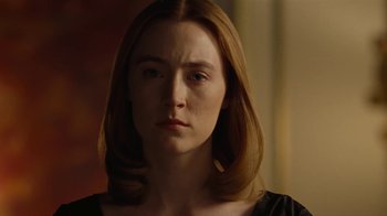 Movie still from “On Chesil Beach” (2017), directed by Dominic Cooke – A person with long brown hair; Close Up shot, Over the shoulder angle