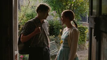 Movie still from “On Chesil Beach” (2017), directed by Dominic Cooke – A man and a woman standing next to each other; Medium shot, Over the shoulder angle