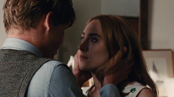 Movie still from “On Chesil Beach” (2017), directed by Dominic Cooke – A man and a woman looking at one another; Close Up shot, Over the shoulder angle