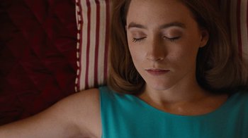 Movie still from “On Chesil Beach” (2017), directed by Dominic Cooke – A person laying on a bed; Close Up shot, Overhead angle