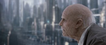 Movie still from “Mr. Nobody” (2009), directed by Jaco Van Dormael – An old man looking out of a window at a city; Close Up shot, Over the shoulder angle
