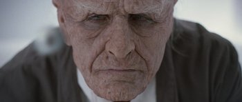 Movie still from “Mr. Nobody” (2009), directed by Jaco Van Dormael – An old man with wrinkled skin and wrinkles on his face; Extreme Close Up shot, Low angle