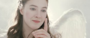 Movie still from “Mr. Nobody” (2009), directed by Jaco Van Dormael – A beautiful young lady posing for a picture; Close Up shot, Over the shoulder angle