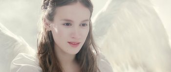 Movie still from “Mr. Nobody” (2009), directed by Jaco Van Dormael – A person with long brown hair; Close Up shot, Over the shoulder angle