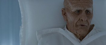 Movie still from “Mr. Nobody” (2009), directed by Jaco Van Dormael – An old man in a white shirt is laying in a bed; Close Up shot, High angle