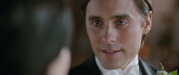 Movie still from “Mr. Nobody” (2009), directed by Jaco Van Dormael – A person wearing a suit and tie; Close Up shot, Over the shoulder angle