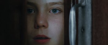 Movie still from “Mr. Nobody” (2009), directed by Jaco Van Dormael – A young girl's face with green eyes; Extreme Close Up shot, Overhead angle