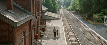 Movie still from “Mr. Nobody” (2009), directed by Jaco Van Dormael – A man and a child walking on a train platform; Extreme Wide shot, High angle