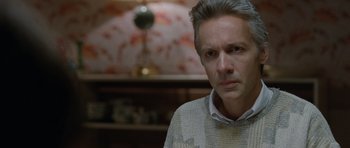 Movie still from “Mr. Nobody” (2009), directed by Jaco Van Dormael – A person wearing a sweater; Close Up shot, Over the shoulder angle
