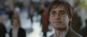 Movie still from “Mr. Nobody” (2009), directed by Jaco Van Dormael – A person wearing glasses; Close Up shot, Over the shoulder angle