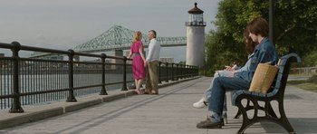Movie still from “Mr. Nobody” (2009), directed by Jaco Van Dormael – A man and a woman standing next to each other on a pier; Wide shot, Over the shoulder angle