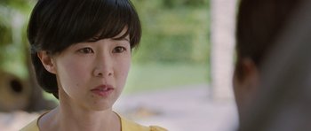 Movie still from “Mr. Nobody” (2009), directed by Jaco Van Dormael – A person wearing a yellow shirt; Close Up shot, Over the shoulder angle