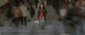 Movie still from “Mr. Nobody” (2009), directed by Jaco Van Dormael – A woman walking down a set of stairs; Wide shot, Low angle