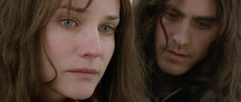 Movie still from “Mr. Nobody” (2009), directed by Jaco Van Dormael – A woman's face and a man's face in the background; Close Up shot, Over the shoulder angle