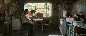 Movie still from “Mr. Nobody” (2009), directed by Jaco Van Dormael – A man sitting in front of a window in a room; Wide shot, Over the shoulder angle